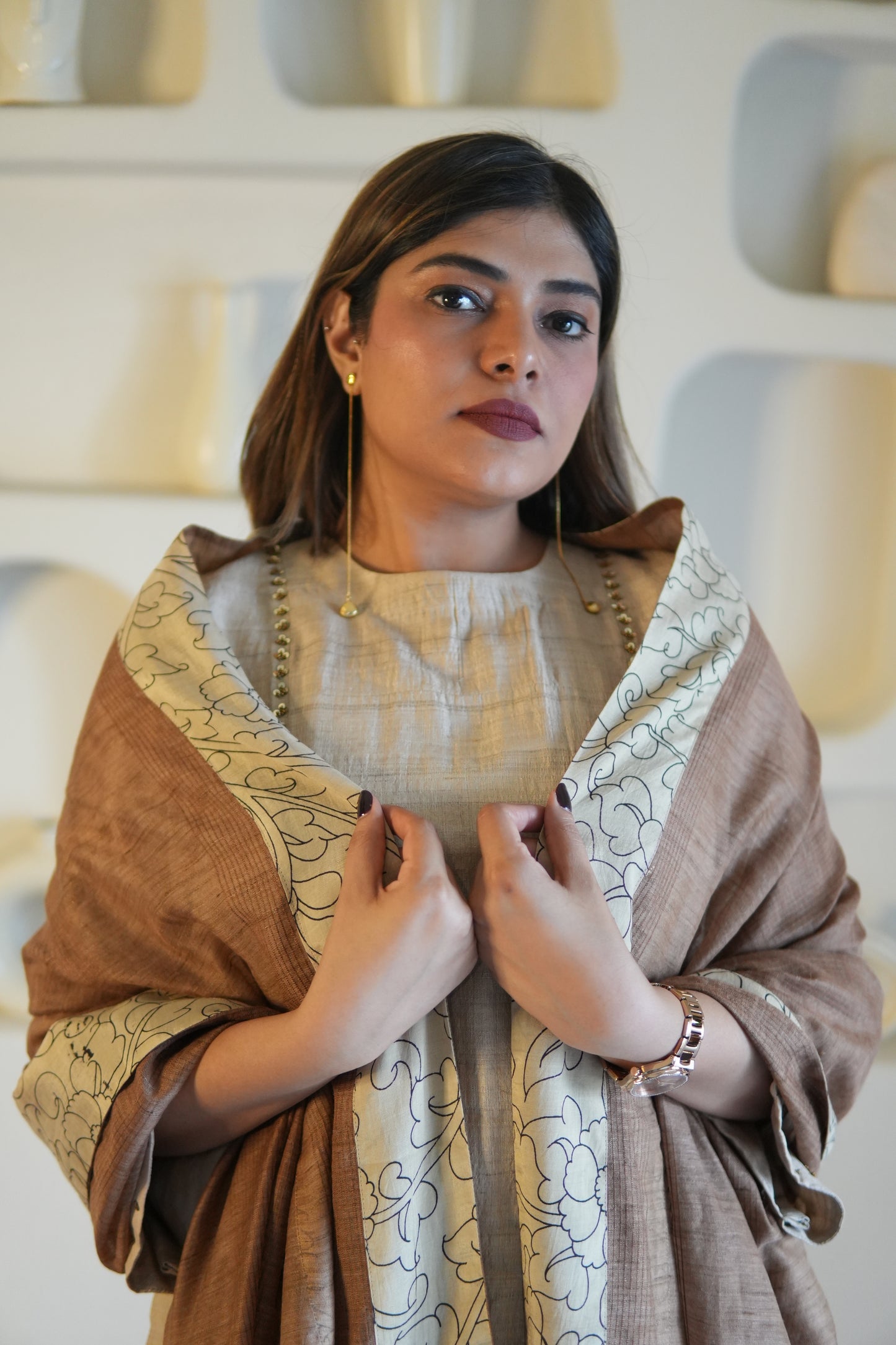 Woman wearing a raw silk kurta with intricate patterns and textures.